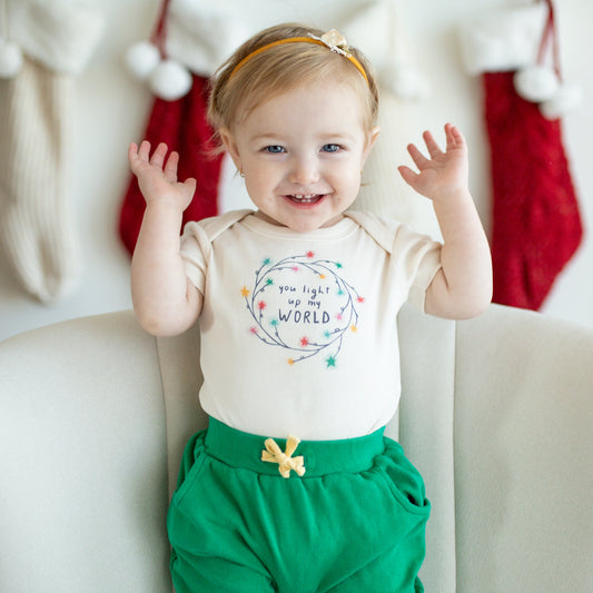 Finn+Emma's buttery-soft organic bodysuit features cheerful graphics printed with non-toxic dyes and comes with easy-snap fasteners for convenient diaper changes.